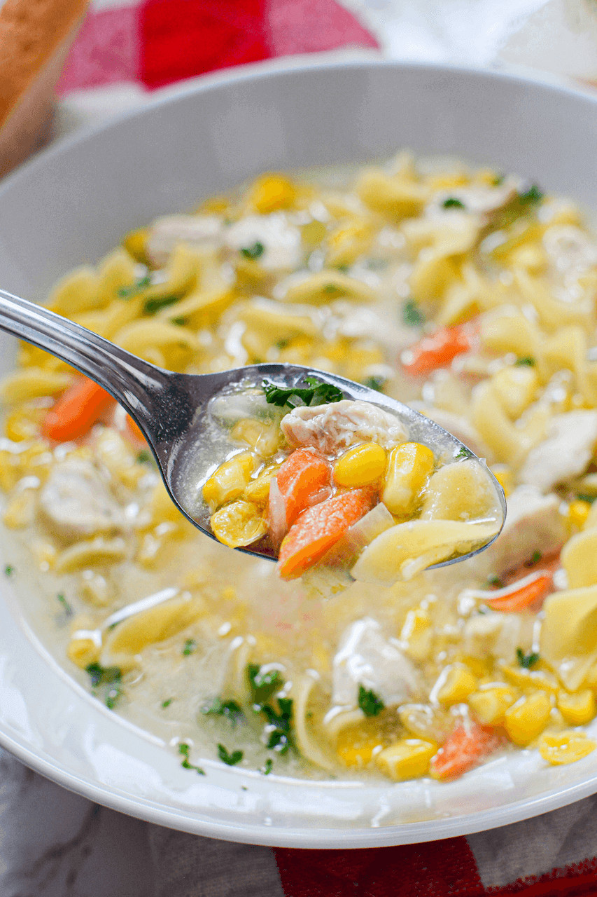 Serving up a dish of the chicken corn noodle soup.