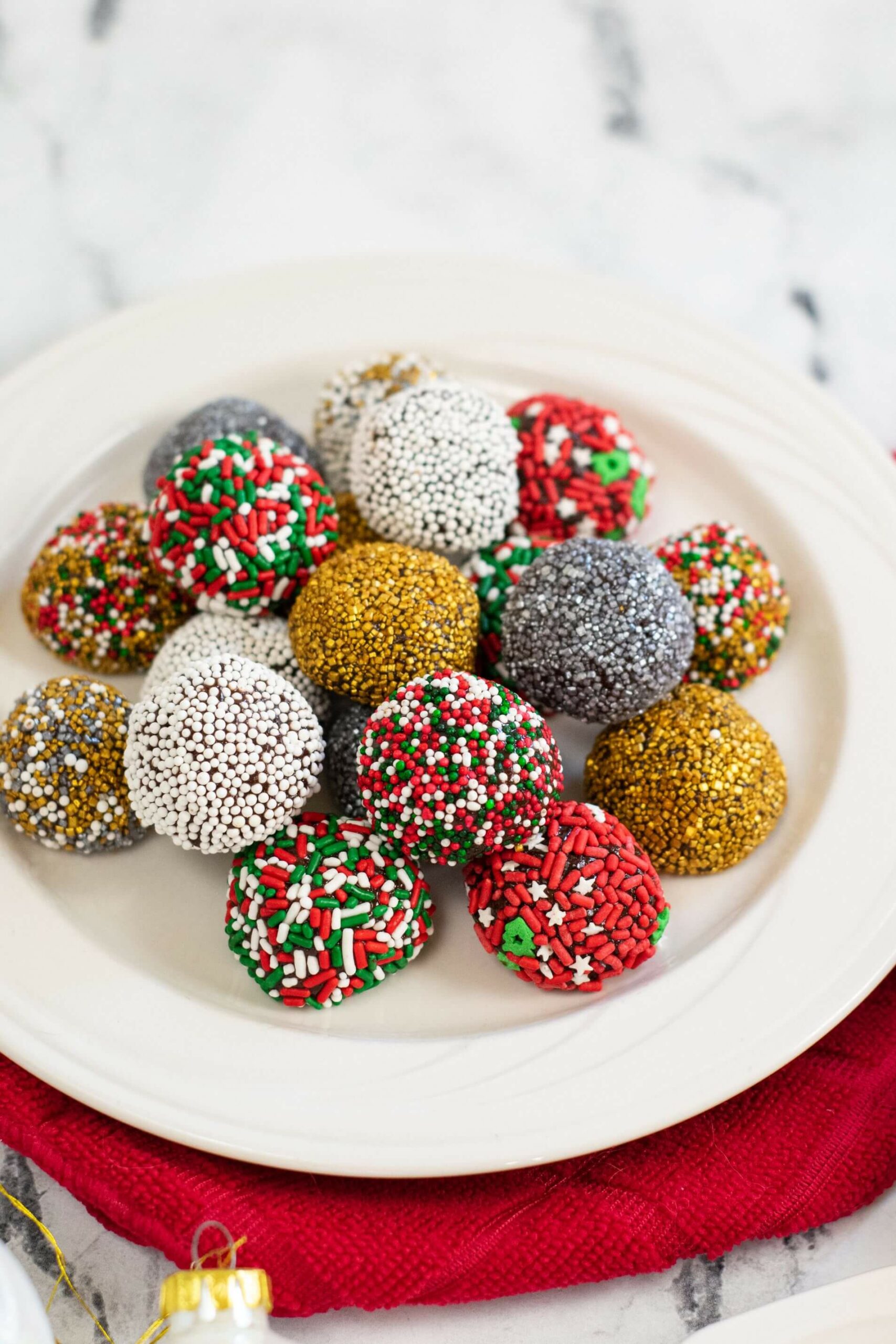 Christmas Brownie Balls on a white tray.