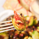 A fork of Crispy Brussels Sprouts with Prosciutto.