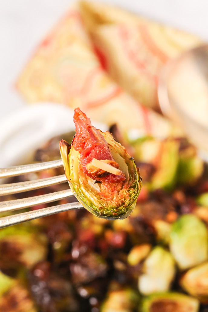 A fork of Crispy Brussels Sprouts with Prosciutto.
