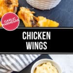 Garlic Parmesan Chicken Wings served with a luscious dip, artfully arranged on a slate board, all set against the backdrop of a cozy striped cloth.