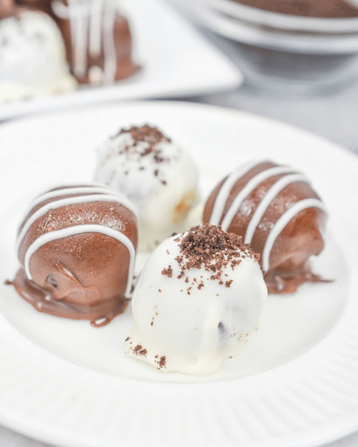 Four white and dark chocolate treats.