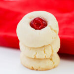 A stack of shortbread with cherries.