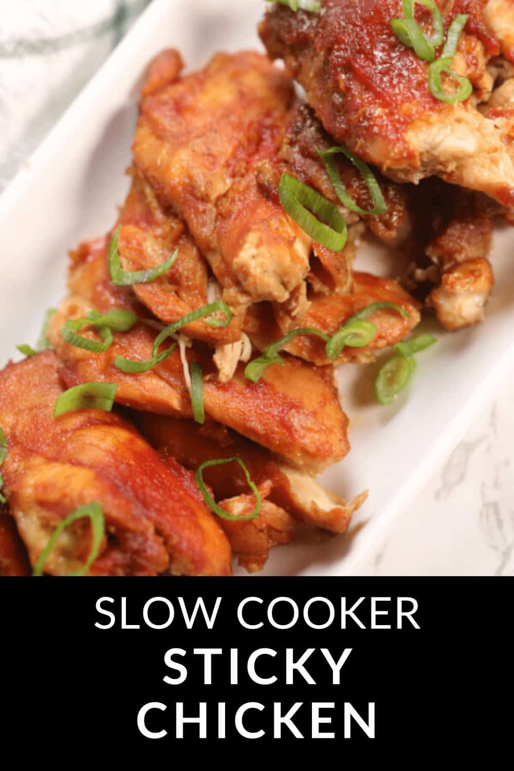 Plate of slow cooker Sticky Chicken garnished with chopped green onions. Text reads: "Indulge in this deliciously sticky delight.