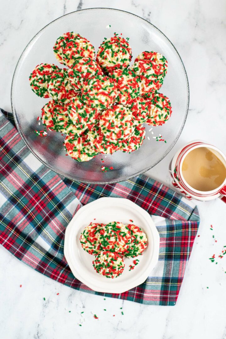 A top shot of sprinkle cookies and coffee.