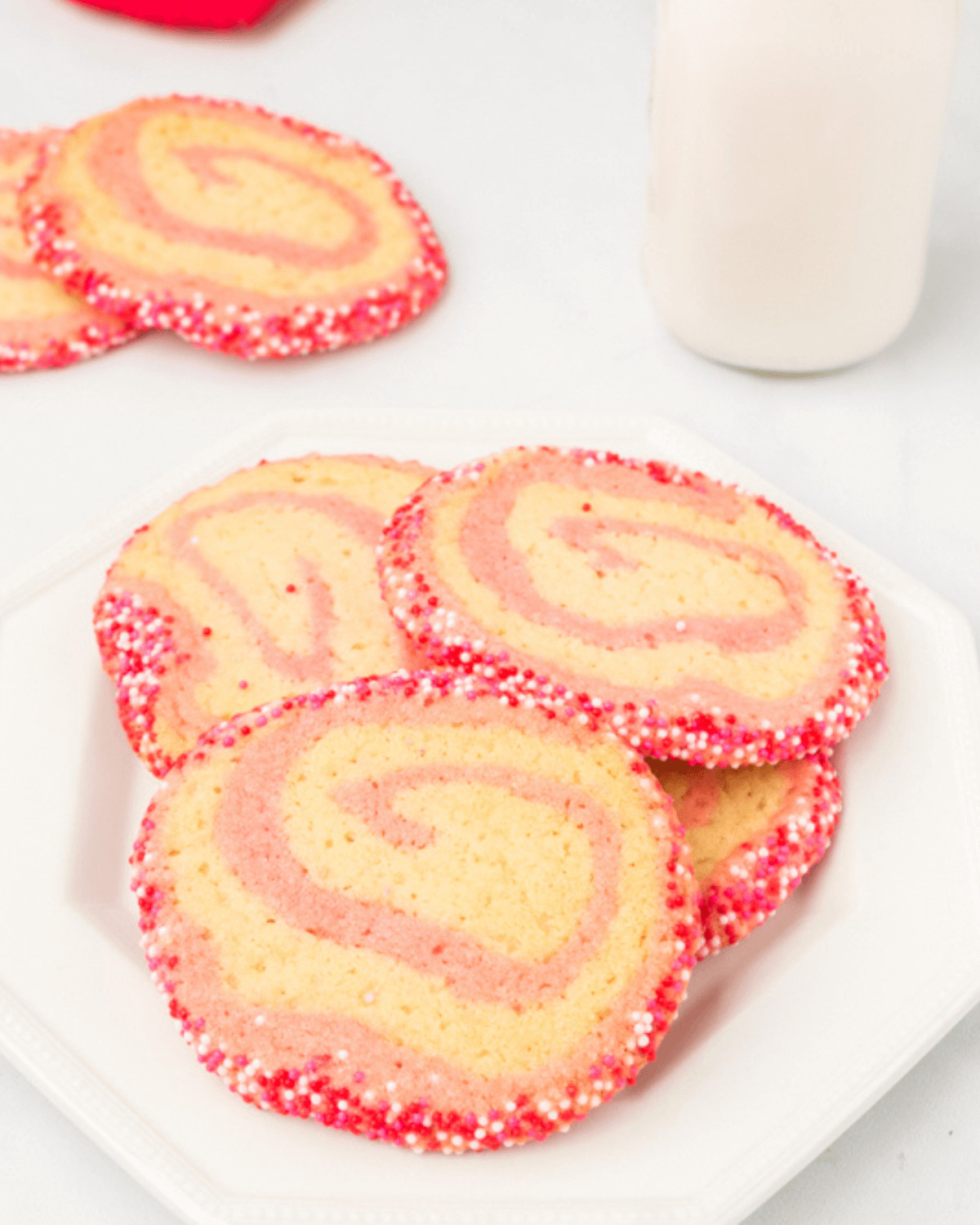 A white plate of the swirled cookies.