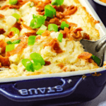 A baked cheese dip with bacon and green onions.