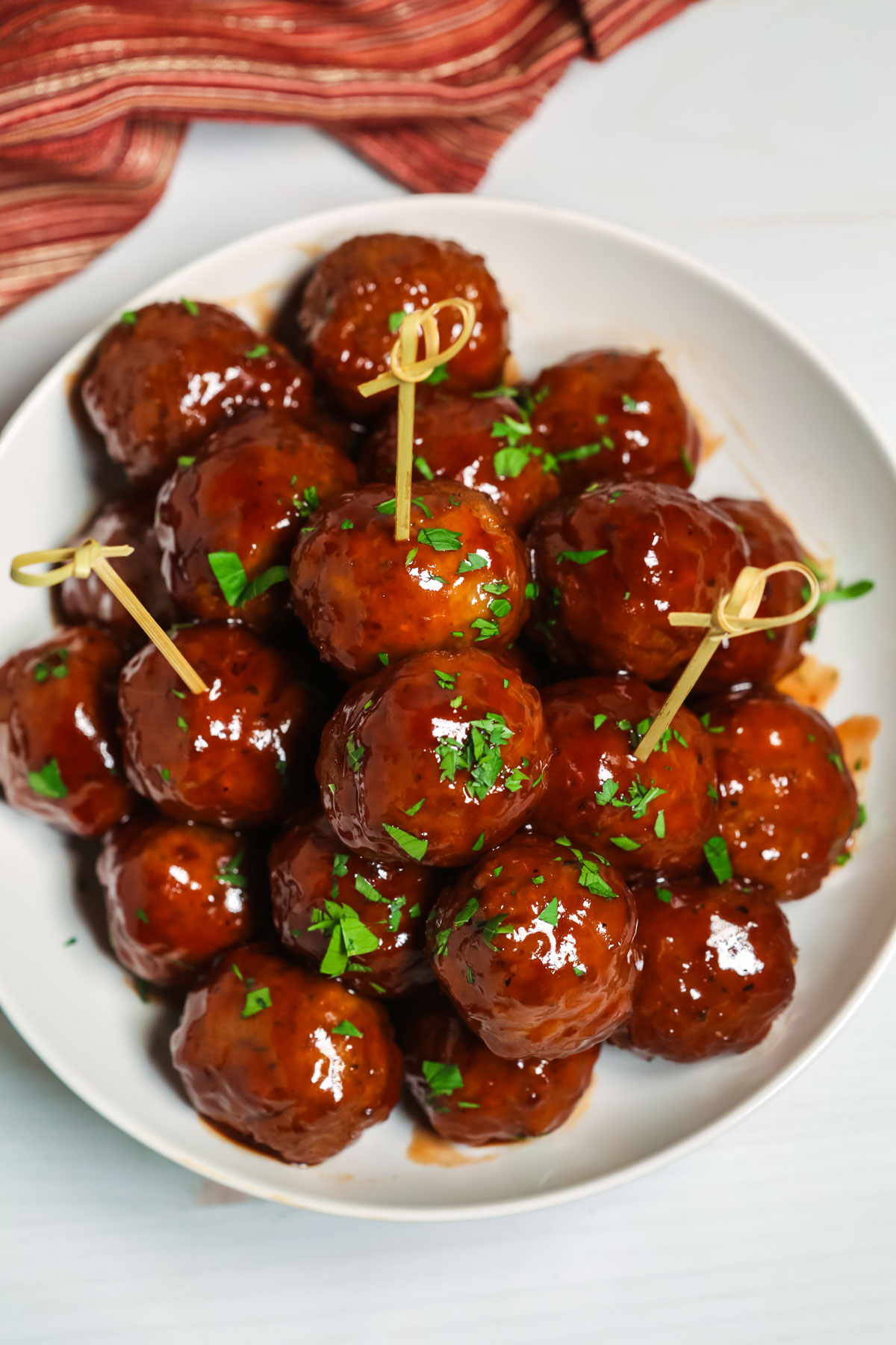 Barbeque Sauce and Grape Jelly Meatballs with toothpicks.