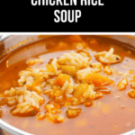 A bowl of Cajun Chicken and Rice soup, brimming with visible pieces of rice, tender chicken, and assorted vegetables swimming in a flavorful red broth.