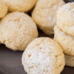 A closeup on the cheesecake cookie coated in powdered sugar.