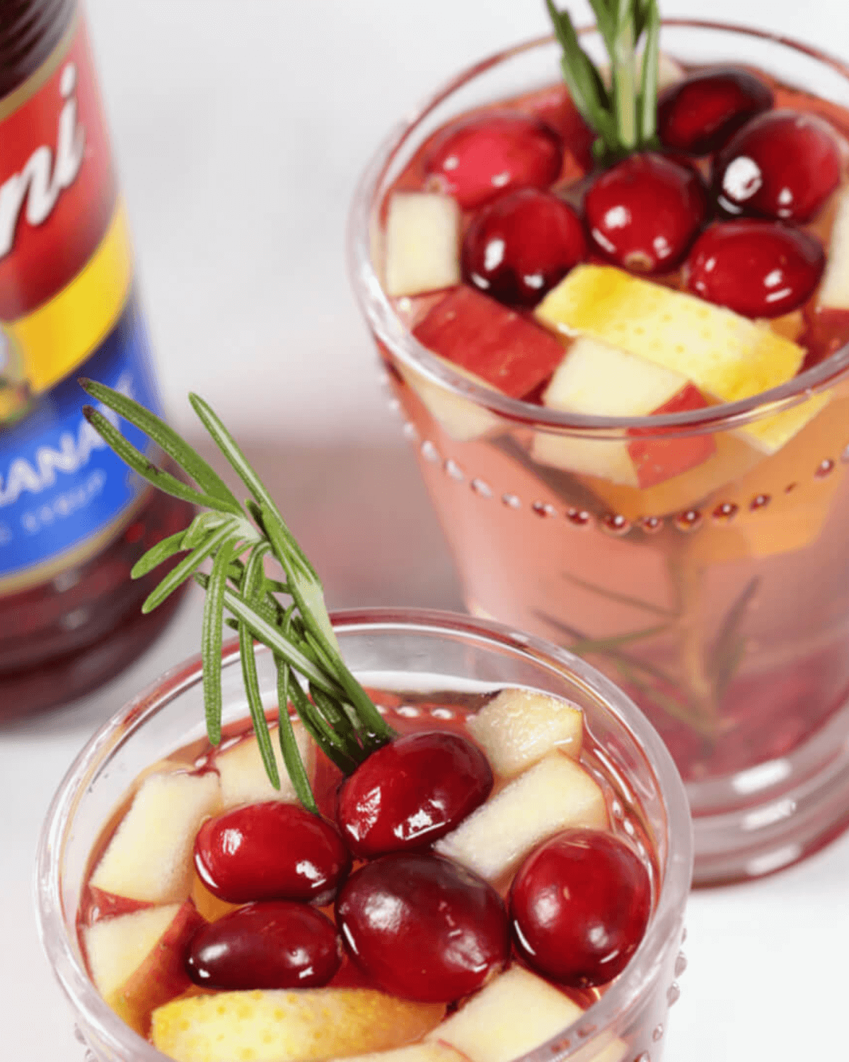Two of the festive drink in clear glasses.