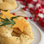 The appetizer with a sprig of rosemary and cheese stars.