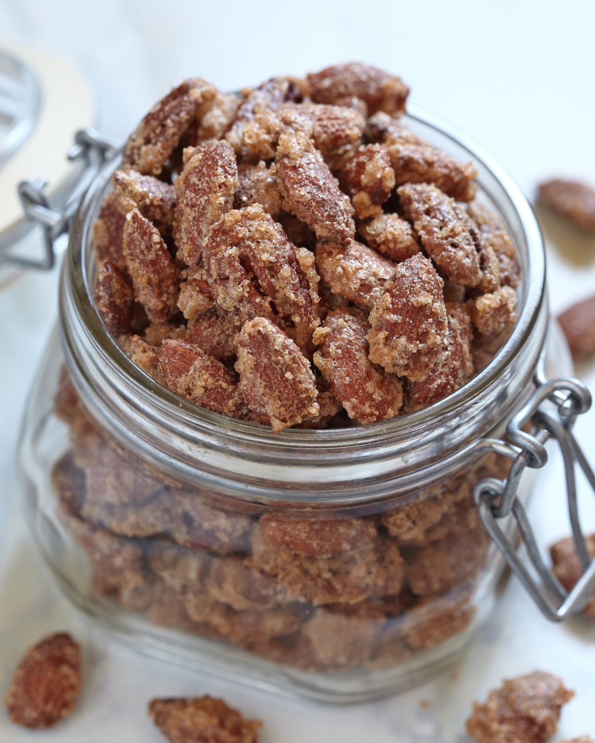 A glass jar of the cinnamon roasted pecans.