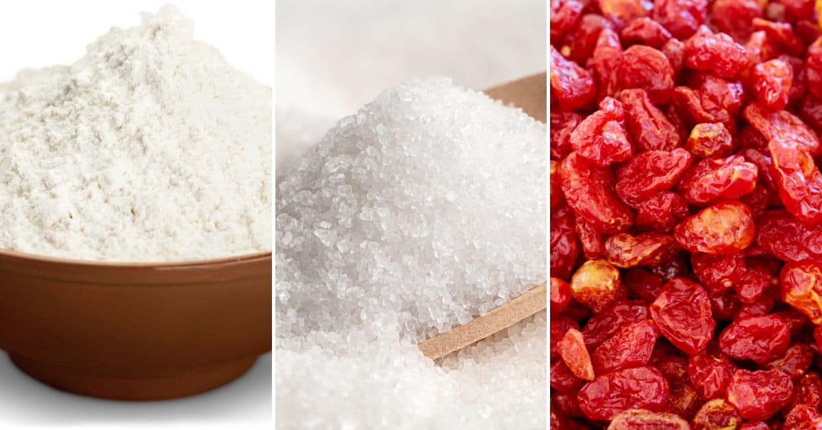 A wooden bowl with flour, a wooden scoop filled with granulated sugar, and a pile of dried red berries are displayed side by side, ready to become delicious Welsh cookies.
