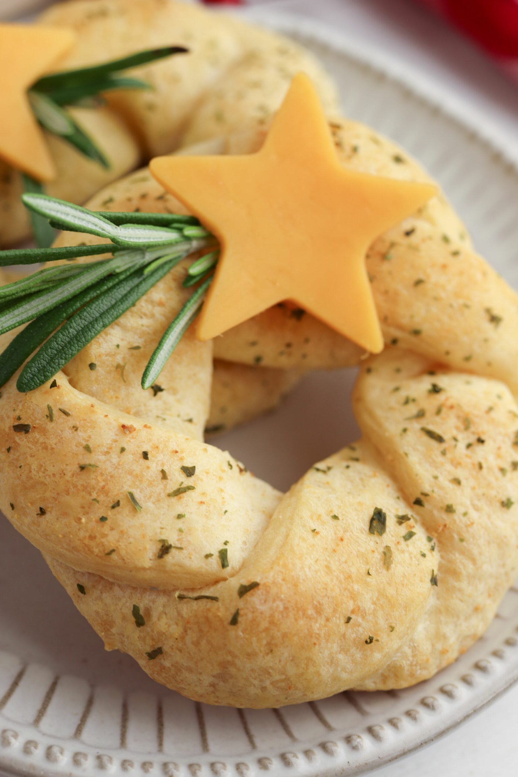 Crescent Roll Wreaths with a sprig of rosemary.
