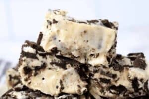 Close-up of Old Fashioned Fudge pieces, featuring a creamy white base packed with chunks of chocolate cookies for a classic cookies and cream treat.