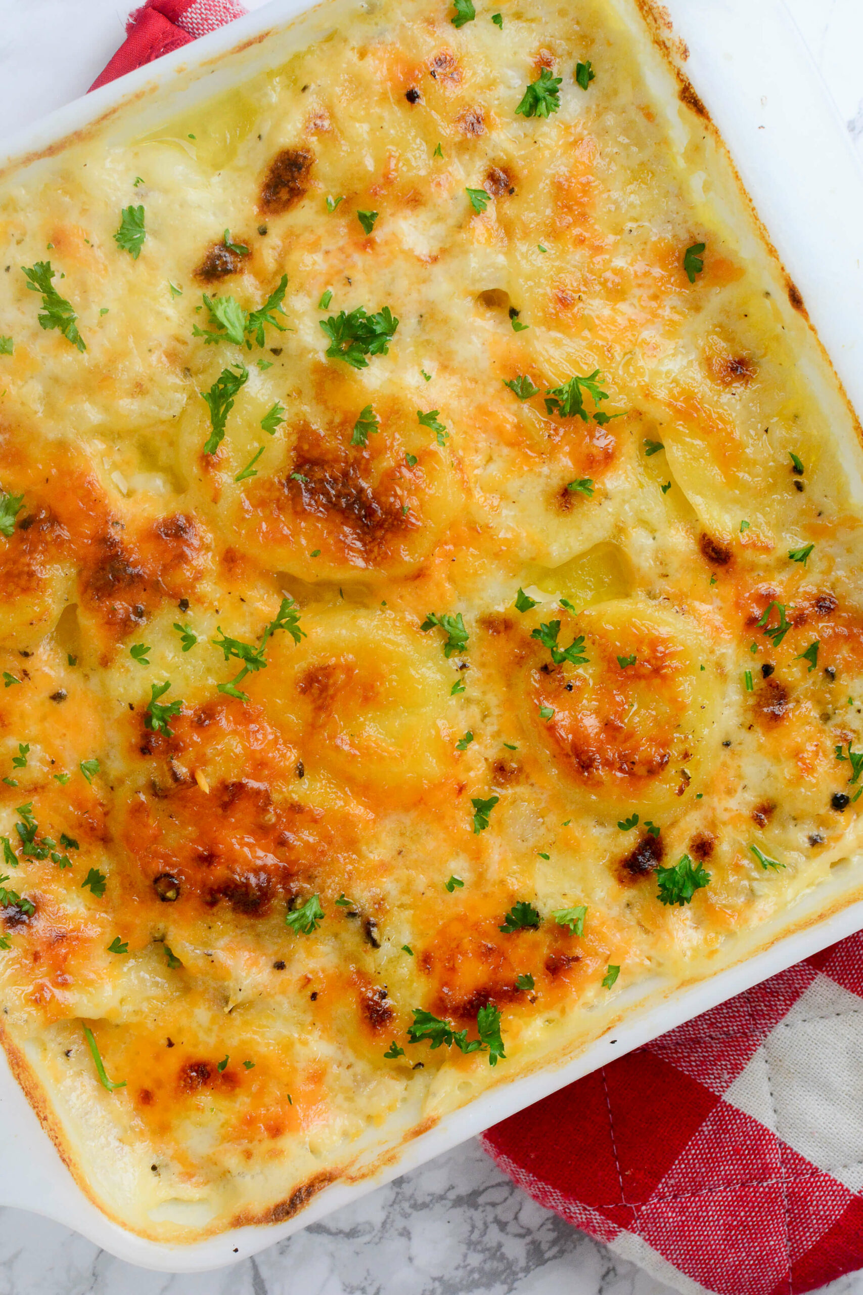A casserole dish of the Scalloped Potatoes with Gruyere.