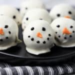 A smiling snowman oreo ball.