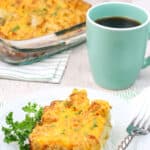 Tater tot breakfast casserole on a white plate.