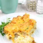 A fork full of the tater tot breakfast casserole.