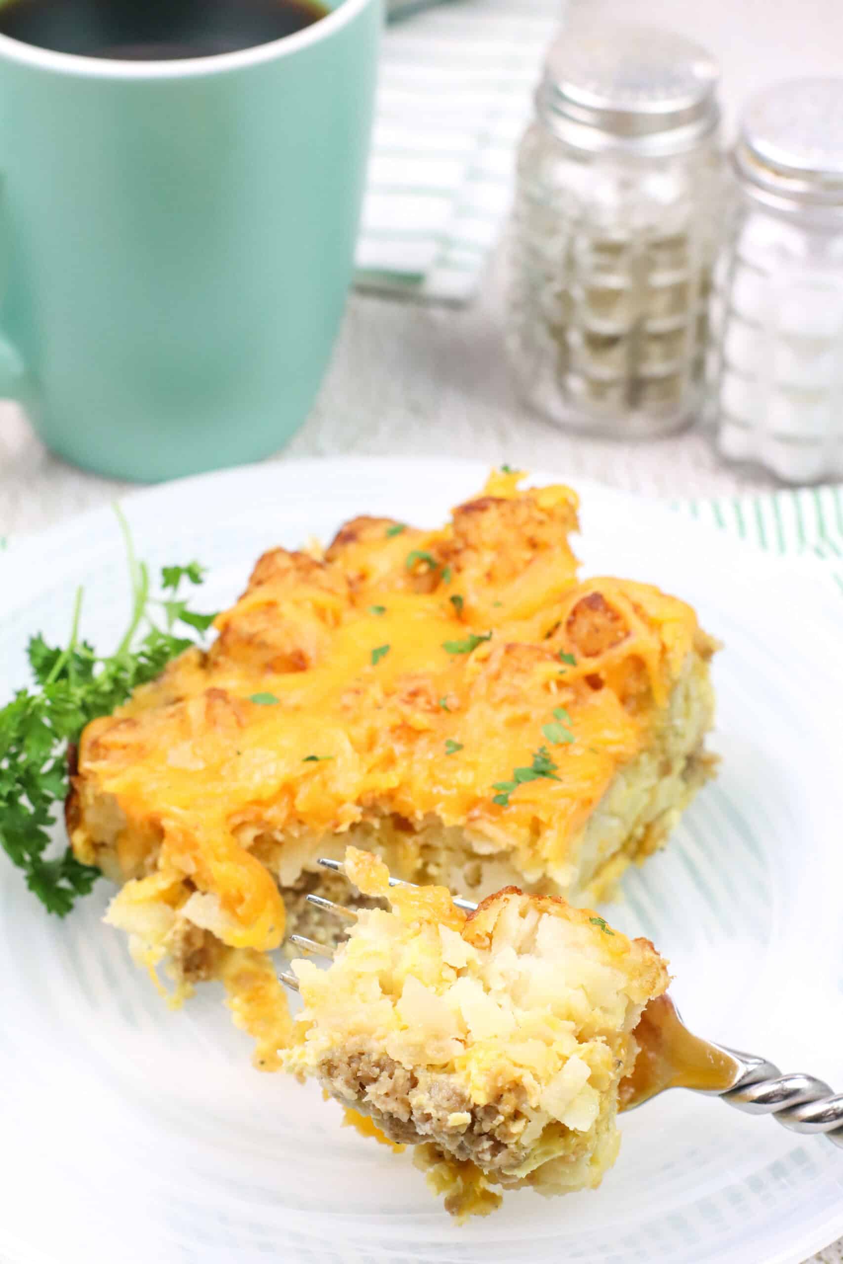 A fork full of the tater tot breakfast casserole.