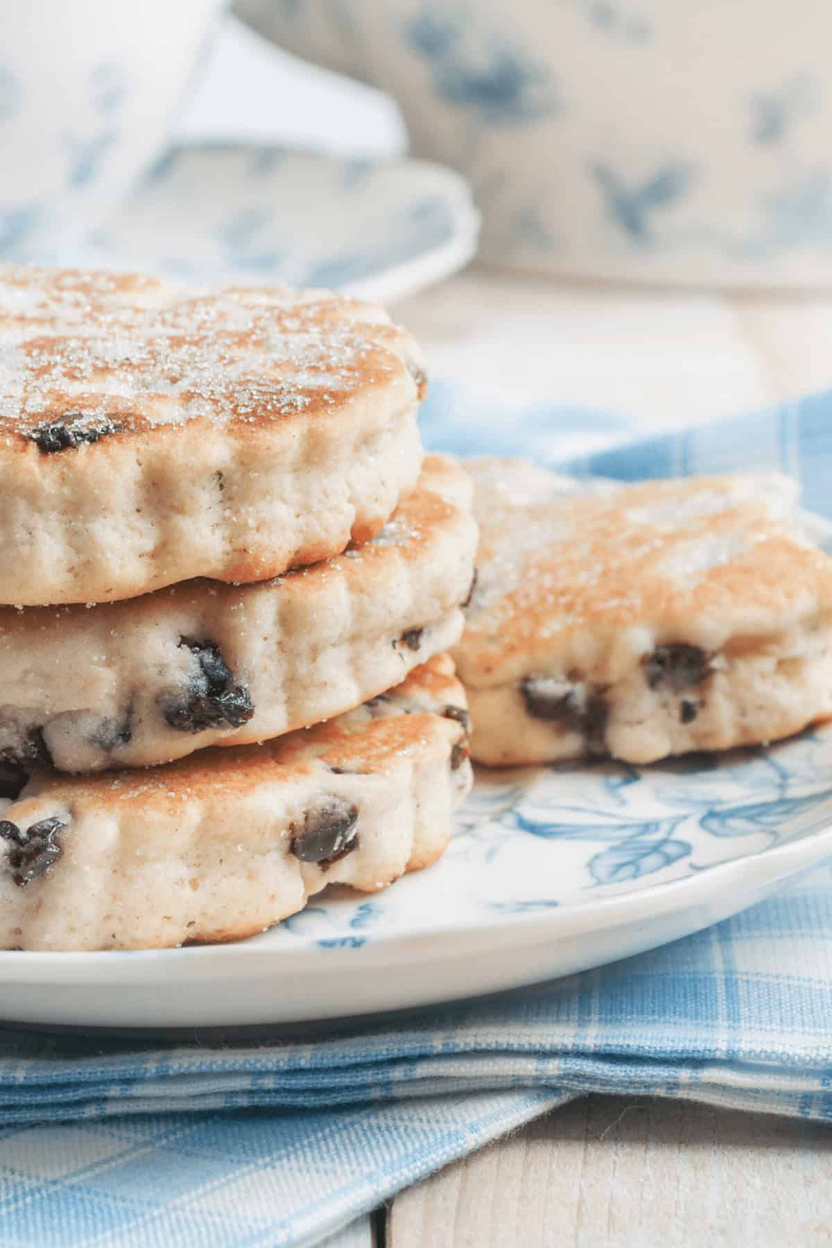 A stack of three sugar-dusted welsh cookies.
