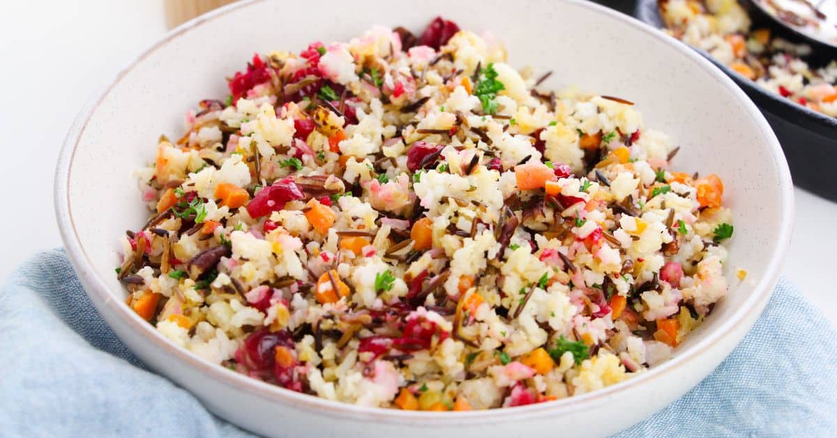 A white bowl filled with easy wild rice pilaf.