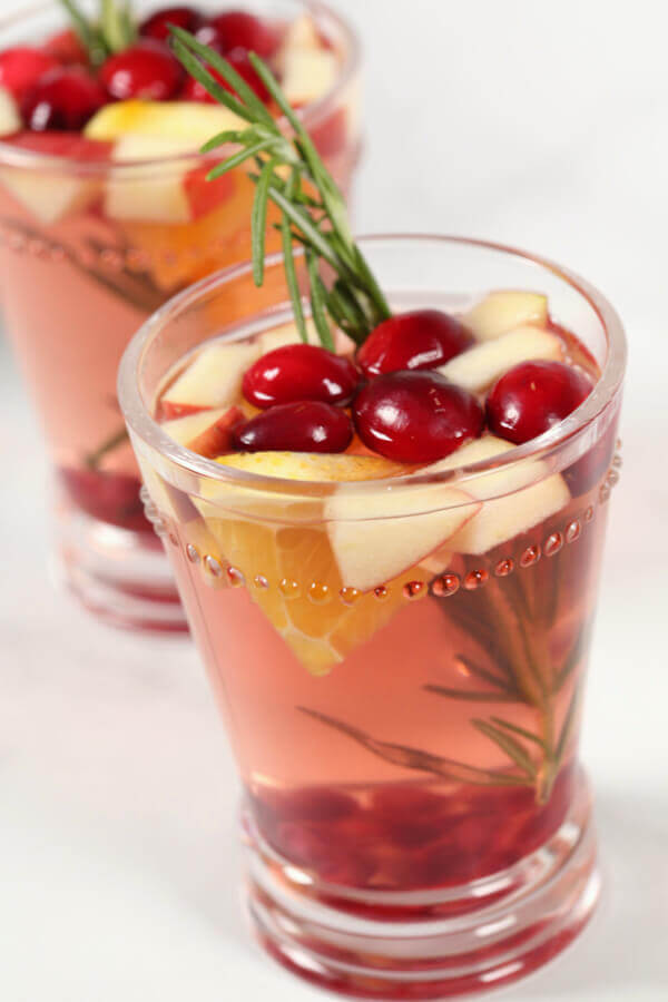 Winter Sangria with a sprig of rosemary in it.