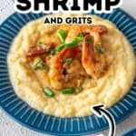 A blue plate with creamy grits topped with Cajun-seasoned shrimp and chopped green onions; labeled text reads "Cajun Shrimp and Grits—Creamy and flavorful!.