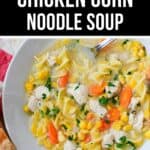 A hearty bowl of Chicken Corn Noodle Soup with carrots, corn, parsley, and tender chicken pieces, served alongside a slice of bread for a comforting meal.