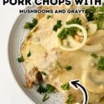 A plate of Pork Chops with Mushrooms and Gravy, topped with sliced onions and fresh parsley, is described as a creamy dish perfect for comfort food lovers.