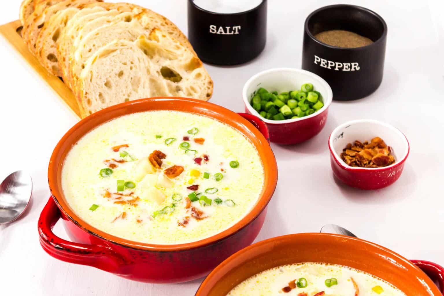 Several red bowls of the soup.
