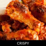 Close-up of honey BBQ wings, showcasing a crispy, glazed texture with a rich, reddish-brown color.