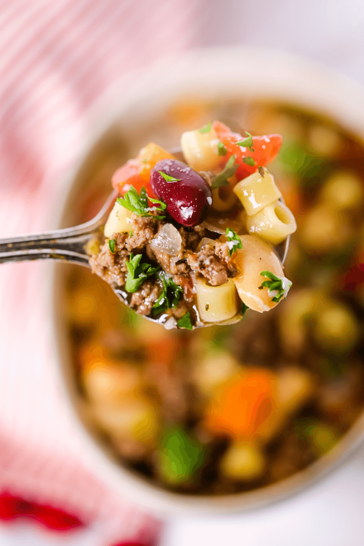 A spoonful of the Italian dish on a stripped placemat.