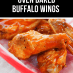 A close-up of crispy oven-baked buffalo wings on a red tray, perfectly coated in sauce.