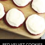 Five Red Velvet Cookies with Cream Cheese Frosting are arranged on a wooden board. A black section at the bottom displays the text "Red Velvet Cookies with Cream Cheese Frosting.