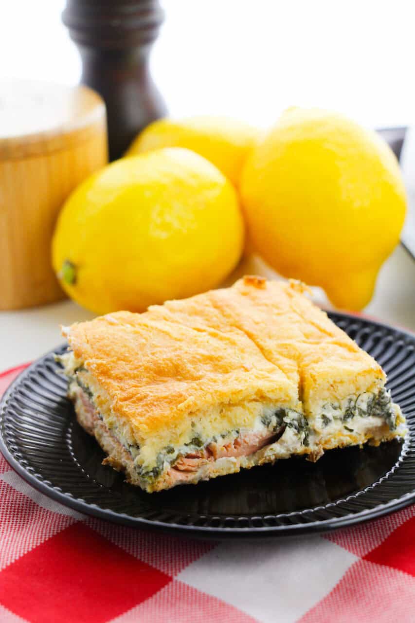 A picture of the salmon dish and the lemons in the background.