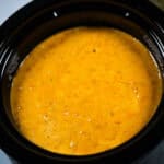 The appetizer with a bread loaf partially visible in the background.