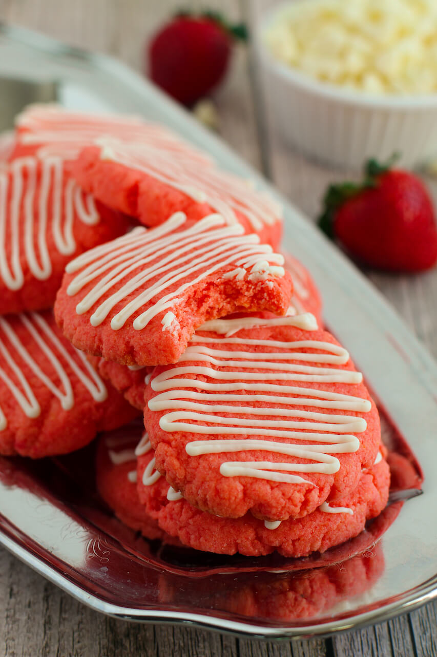 Strawberry Cake Mix Cookies with a drizzle of white icing.