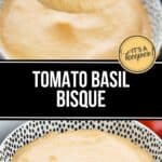 A bowl of creamy Tomato Basil Bisque with a spoonful held above it; fresh tomatoes are visible in the background.