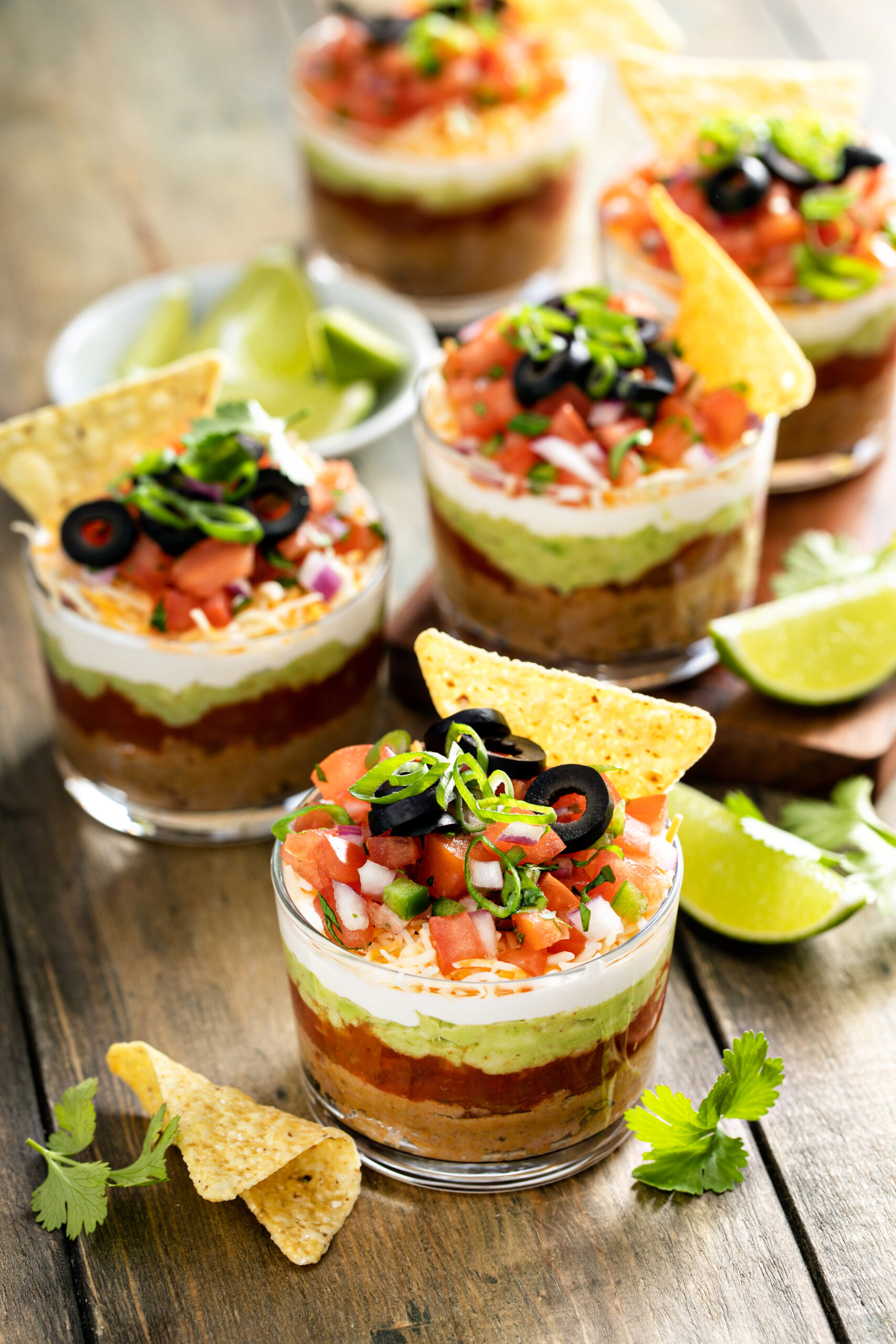 A top shot of the Mexican 5 Layer Dip with a chip in it.