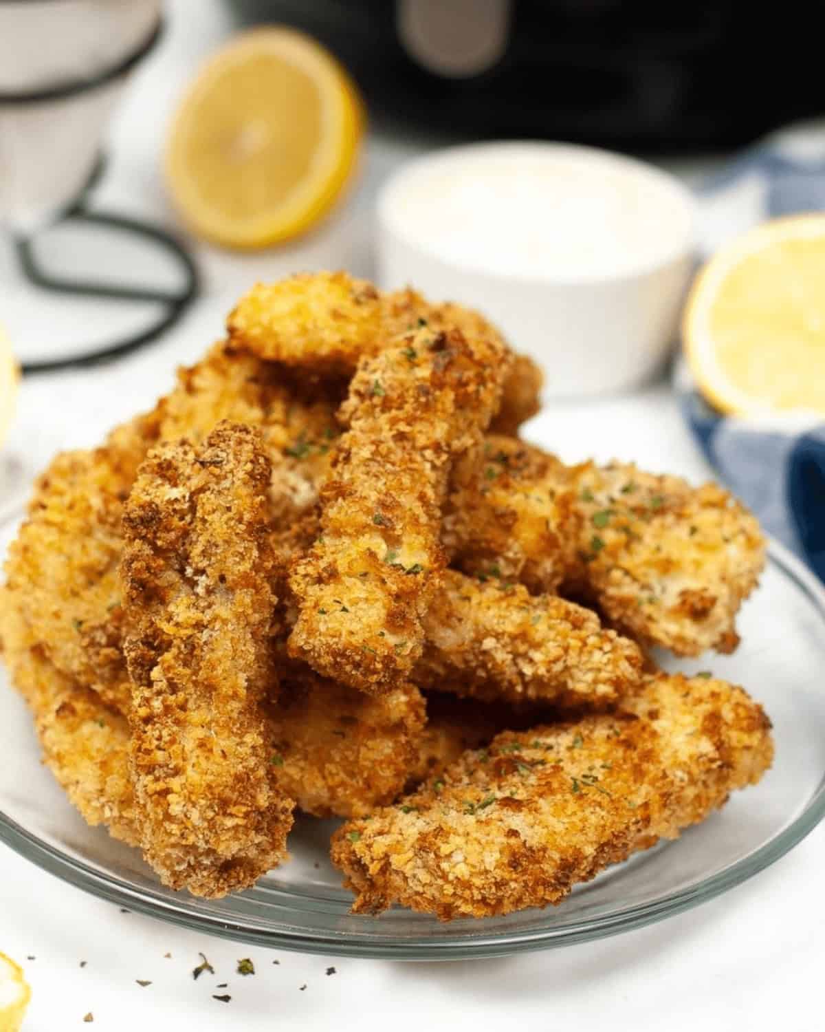 A plate of golden-brown  meat on a white plate.