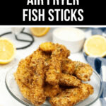 A plate of Air Fryer Fish Sticks served with lemon and dipping sauce.