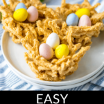 Homemade bird’s nest cookies with candy eggs on a white plate.