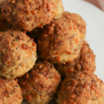 A stack of the breakfast meatballs on a white dish.