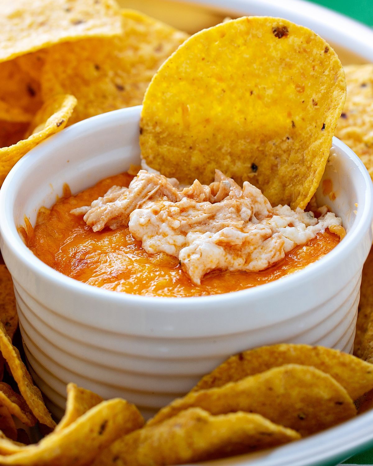Buffalo Chicken Dip with a chip in it.