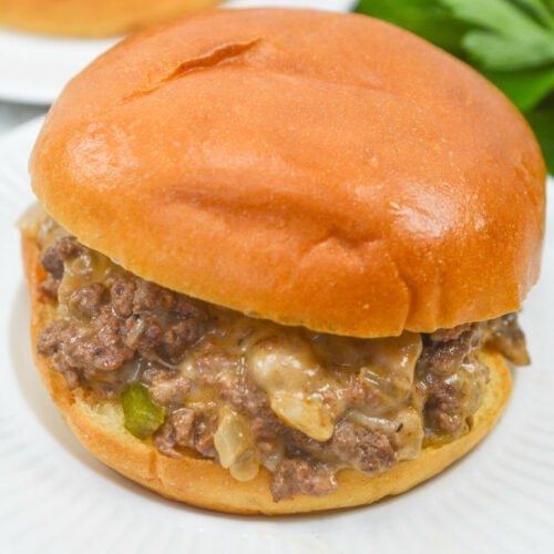A white plate of the cheesesteak sloppy joes.