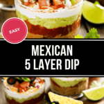 A glass cup filled with a vibrant 5 Layer Dip showcases beans, guacamole, sour cream, salsa, and cheese, garnished with olives and green onions. A tortilla chip is artfully placed in the dip with a lime wedge and cilantro nearby.