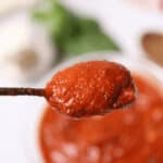 A spoonful over a bowl.