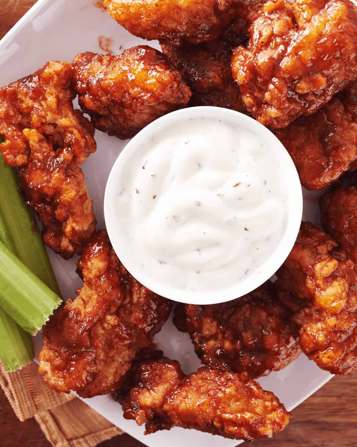 BBQ chicken wings with celery .